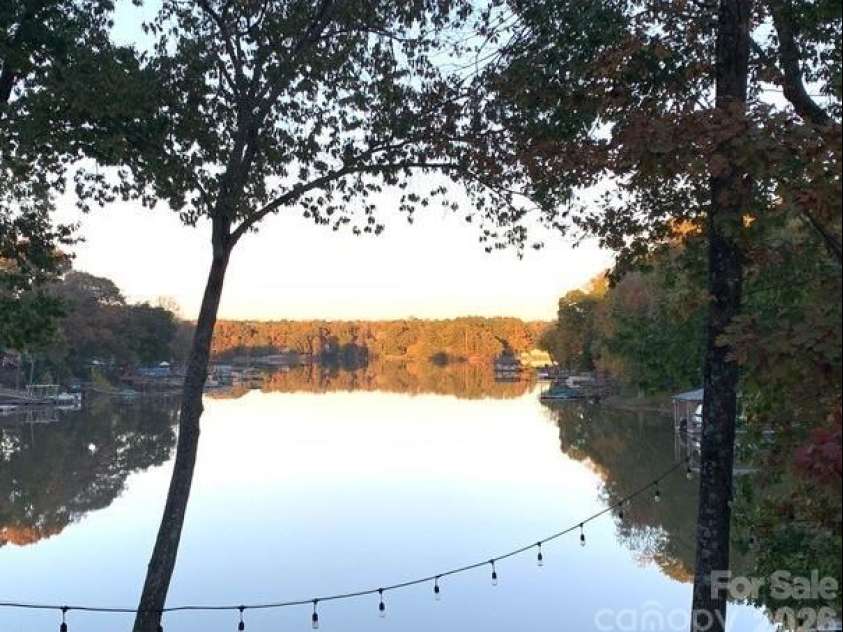1075 Lakefront Woods Drive, Belmont, NC 28012.  MLS# CAR4402621, YatesRealty ID 44942. Evening sunset view