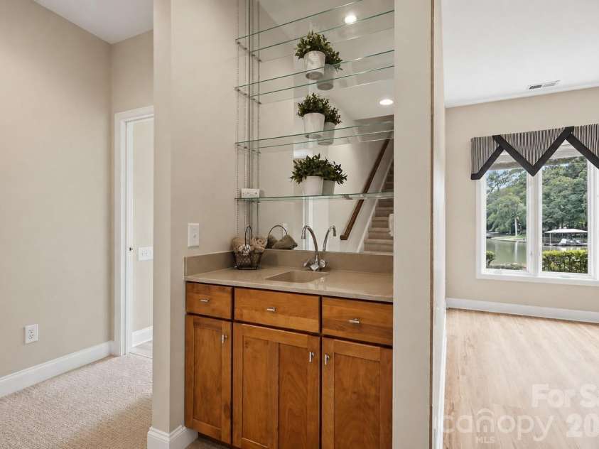 1075 Lakefront Woods Drive, Belmont, NC 28012.  MLS# CAR4402621, YatesRealty ID 44942. Lower level wet bar