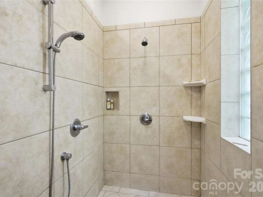 1075 Lakefront Woods Drive, Belmont, NC 28012.  MLS# CAR4402621, YatesRealty ID 44942. Massive custom walk-in shower