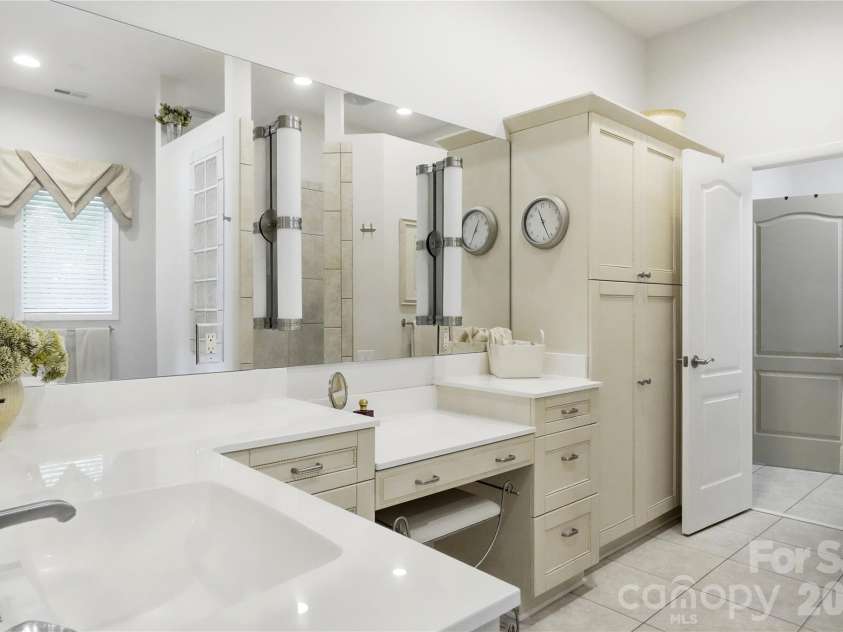 1075 Lakefront Woods Drive, Belmont, NC 28012.  MLS# CAR4402621, YatesRealty ID 44942. Primary bath boasts dual vanities.