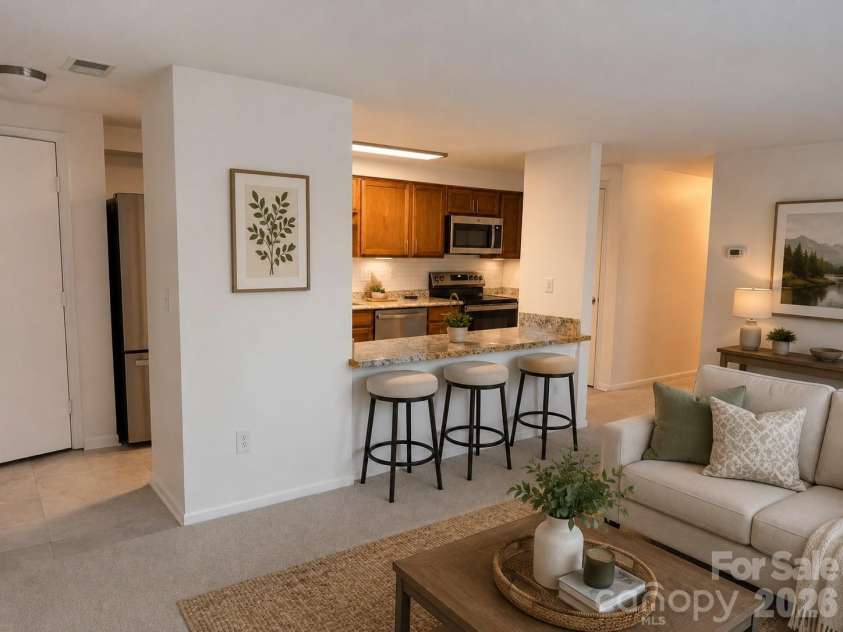 1645 Arlyn Circle, Charlotte, NC 28213.  MLS# CAR4404772, YatesRealty ID 44948. Staged bar-living area