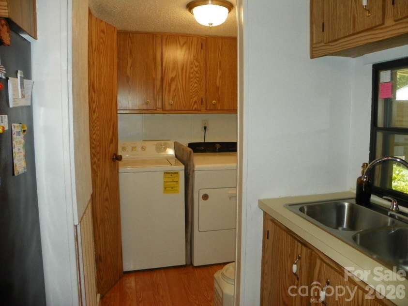 162 Fifth Avenue, New London, NC 28127.  MLS# CAR4415533, YatesRealty ID 44954. Laundry room off Kitchen