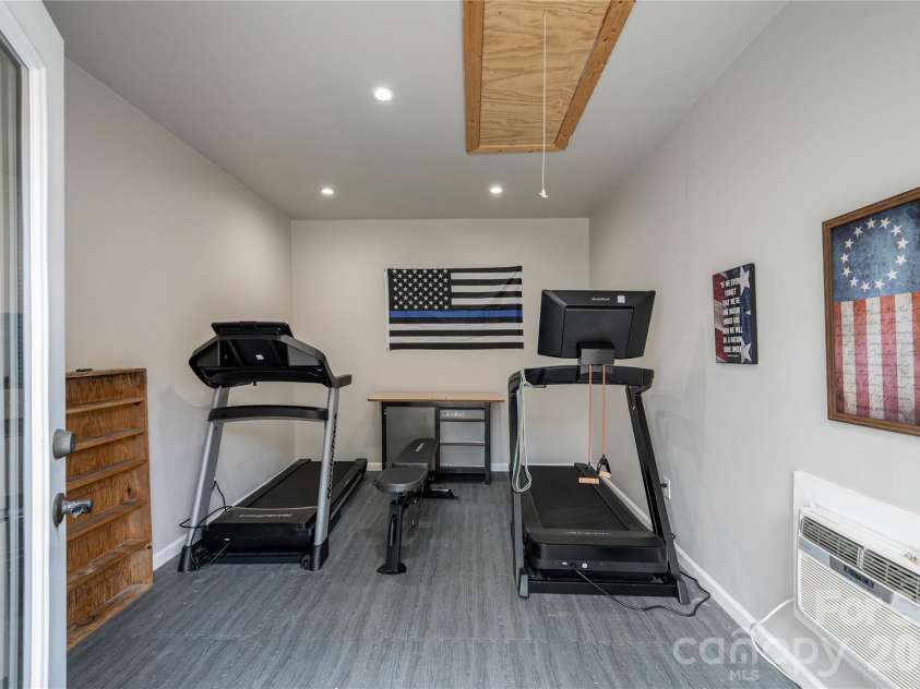 8 Blaines Way, Candler, NC 28715.  MLS# CAR4406500, YatesRealty ID 44964. Conditioned gym space in detached garage