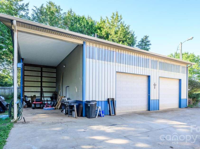 114 Harness Lane, Mocksville, NC 27028.  MLS# CAR4300524, YatesRealty ID 45. Oversized 2 Car Garage/Workshop
