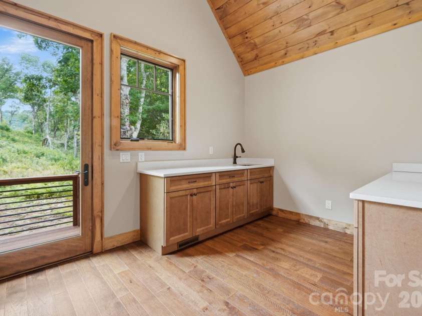 761 Foxfire Drive, Banner Elk, NC 28604.  MLS# CAR4415541, YatesRealty ID 45002. Main Laundry room.