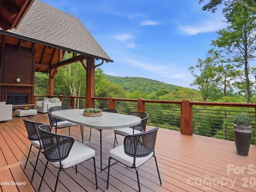 761 Foxfire Drive, Banner Elk, NC 28604.  MLS# CAR4415541, YatesRealty ID 45002. Open back patio with peaceful wooded views.