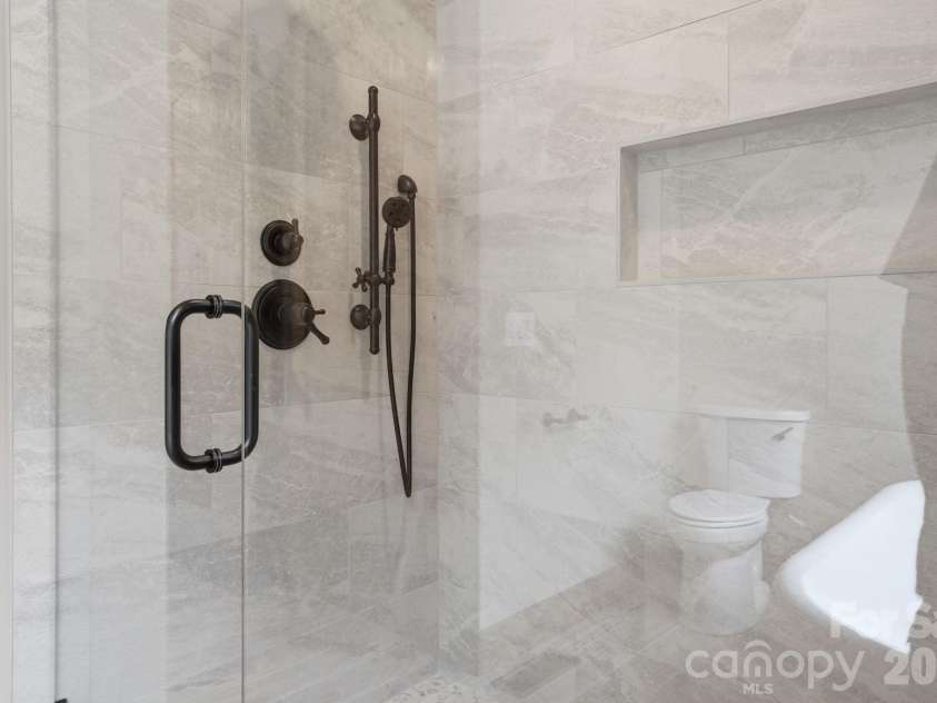 761 Foxfire Drive, Banner Elk, NC 28604.  MLS# CAR4415541, YatesRealty ID 45002. Owners retreat bath features a spacious layout with a walk-in shower and double vanity.
