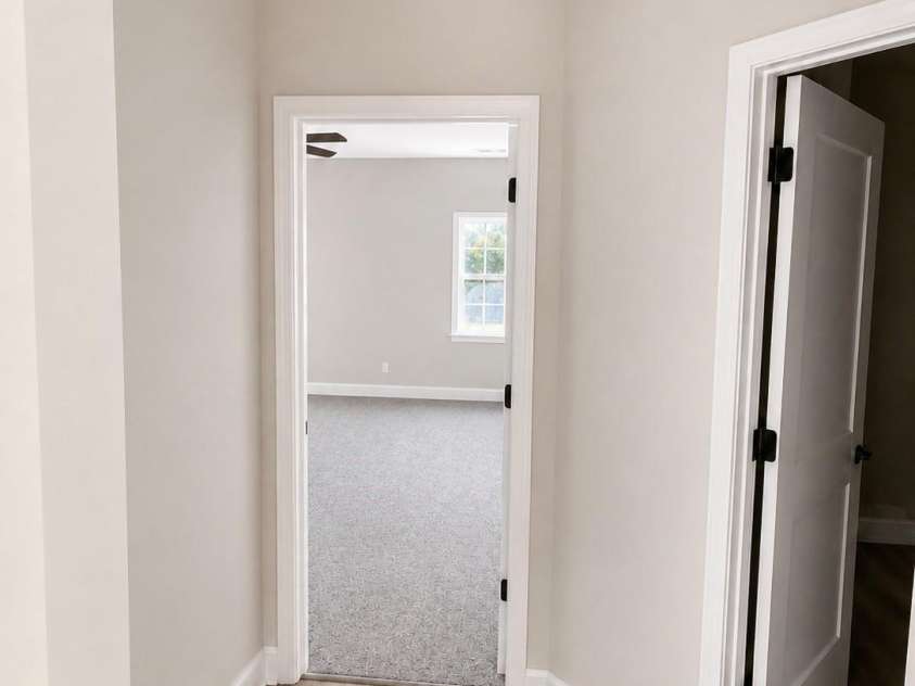 6717 Jesse Rushing Road, Marshville, NC 28103.  MLS# CAR4412435, YatesRealty ID 45006. Hallway to primary suite/ secondary bathroom