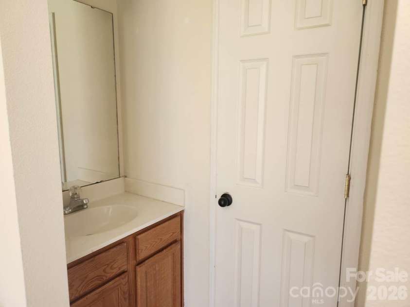 9644 Littleleaf Drive, Charlotte, NC 28215.  MLS# CAR4415285, YatesRealty ID 45026. Primary room Vanity