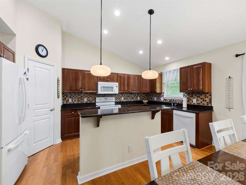 196 Snowy Egret Way, Hendersonville, NC 28792.  MLS# CAR4414886, YatesRealty ID 45031. Bar Seating at the Open Kitchen
