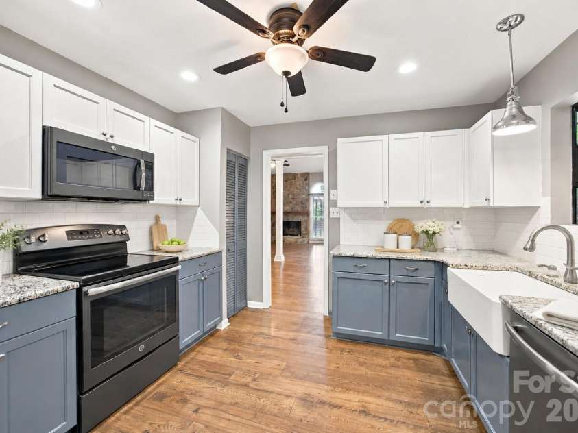 7134 Forest Hills Drive, Denver, NC 28037.  MLS# CAR4413877, YatesRealty ID 45040. Granite counters and farmhouse sink