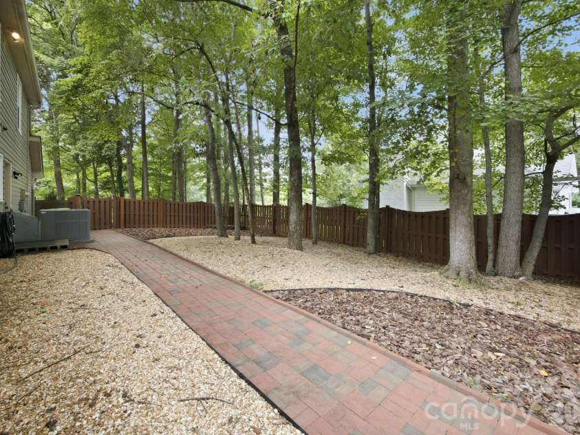 7134 Forest Hills Drive, Denver, NC 28037.  MLS# CAR4413877, YatesRealty ID 45040. Side play area or pet area