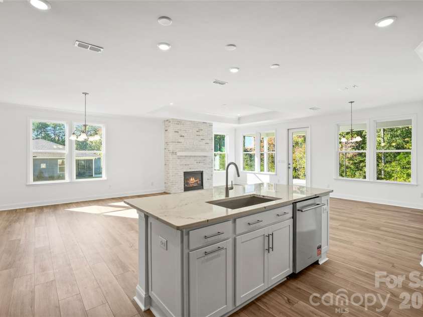 7512 Pedigree Circle, Lancaster, SC 29720.  MLS# CAR4415688, YatesRealty ID 45068. Large kitchen island overlooking open-concept dining, cafe, and gathering space