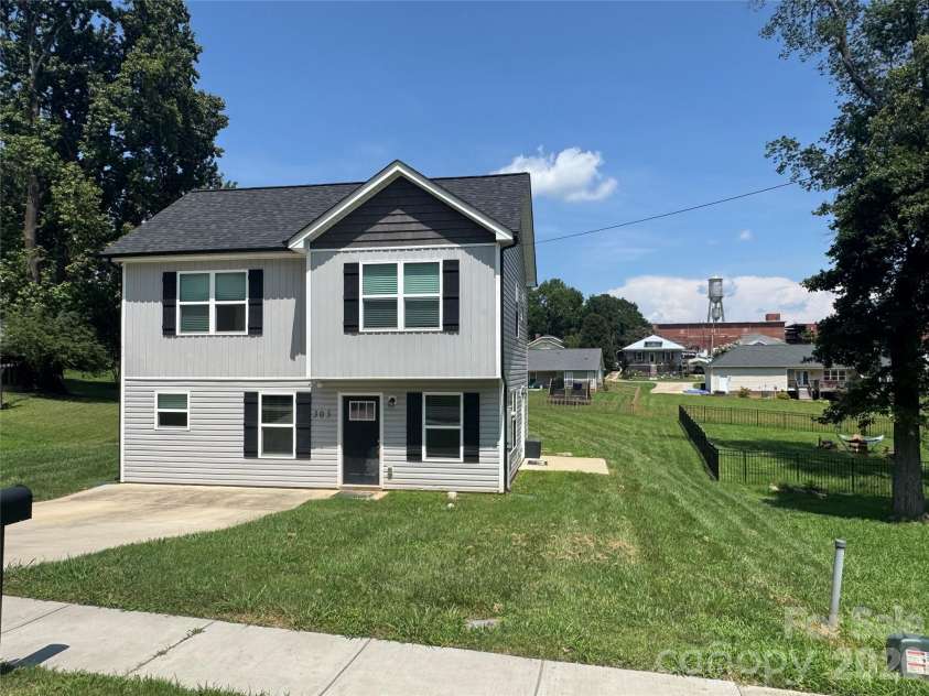 303 2nd Avenue, China Grove, NC 28023.  MLS# CAR4415638, YatesRealty ID 45070. Front elevation