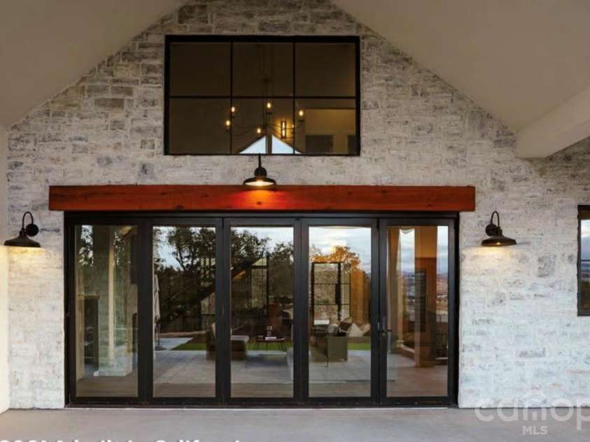Lot 1 Country Estates Drive, Waxhaw, NC 28173.  MLS# CAR4276299, YatesRealty ID 4508. View of Patio Doors Looking from Covered Porch into the Living Room of the Proposed Modern Farmhouse