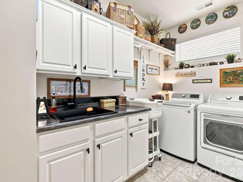 45 Creekside View Drive, Asheville, NC 28804.  MLS# CAR4411206, YatesRealty ID 45086. Off from what's now a lower level dining area, is a second kitchen.