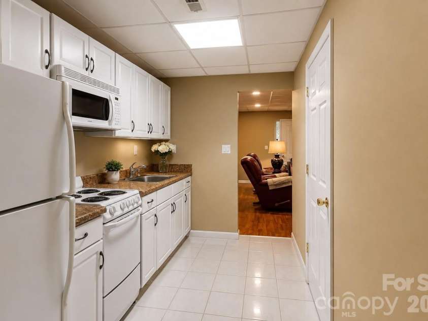 8808 Blooming Arbor Street, Huntersville, NC 28078.  MLS# CAR4423679, YatesRealty ID 45088. Basement kitchen Virtually staged