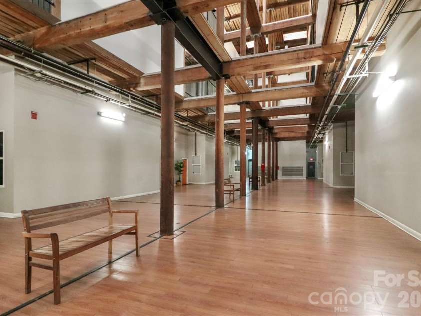 201 Hoskins Road, Charlotte, NC 28208.  MLS# CAR4341701, YatesRealty ID 4509. The historic charm of the building has been retained in the common areas, which feature a rustic style.