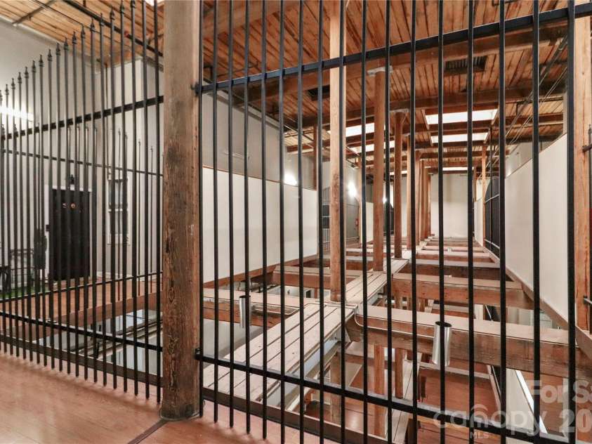 201 Hoskins Road, Charlotte, NC 28208.  MLS# CAR4341701, YatesRealty ID 4509. The historic charm of the building has been retained in the common areas, which feature a rustic style.