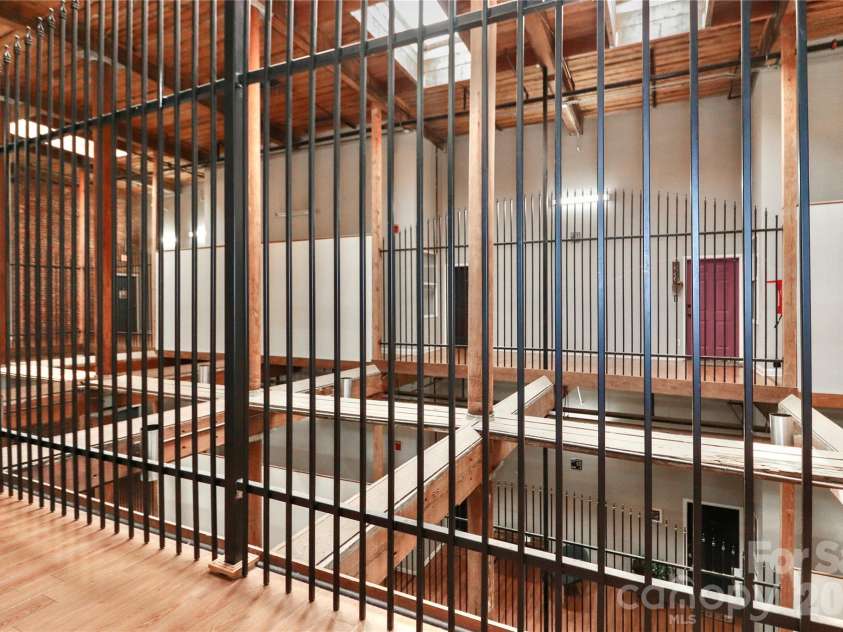 201 Hoskins Road, Charlotte, NC 28208.  MLS# CAR4341701, YatesRealty ID 4509. The historic charm of the building has been retained in the common areas, which feature a rustic style.