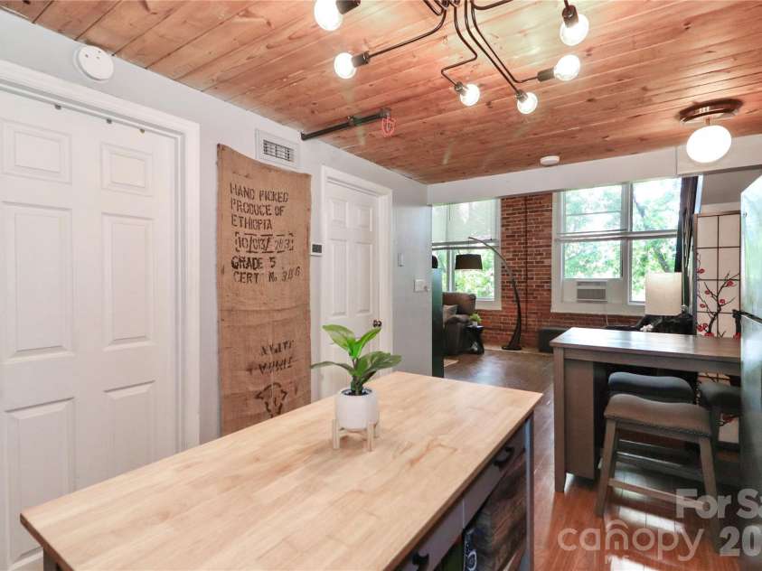 201 Hoskins Road, Charlotte, NC 28208.  MLS# CAR4341701, YatesRealty ID 4509. You will love the natural light! The updated light fixtures and oversized windows make this condo feel open and airy.