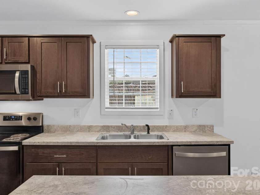 1303 Elrado Street, Burlington, NC 27217.  MLS# CAR4413497, YatesRealty ID 45094. Kitchen window over sink