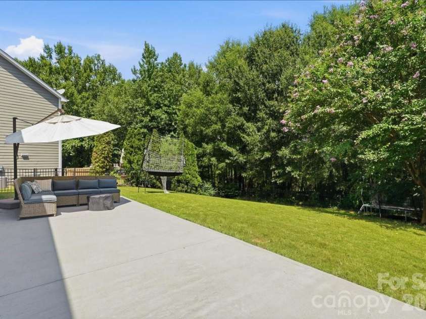 3829 Franklin Meadows Drive, Matthews, NC 28105.  MLS# CAR4412409, YatesRealty ID 45095. Expansive Rear Patio