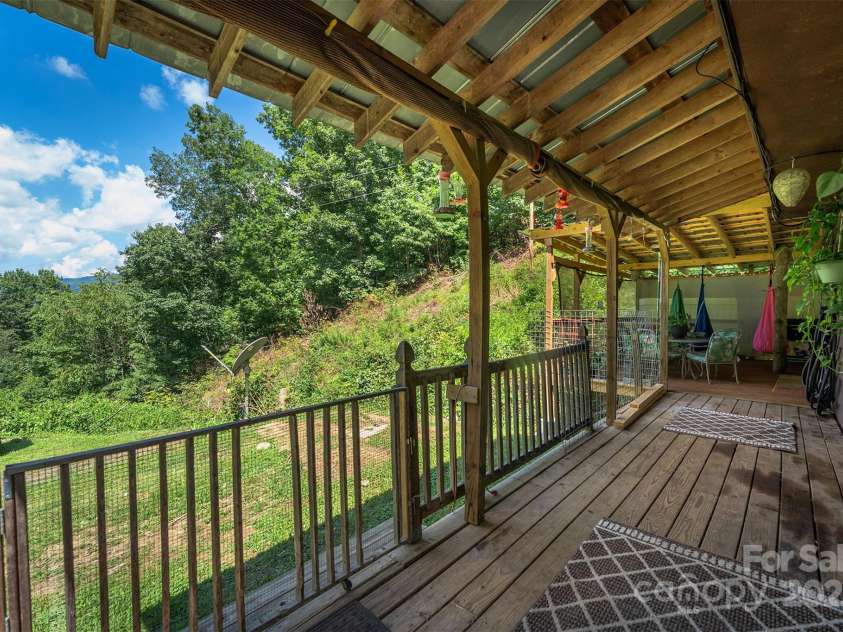 1145 Woolyshot Branch Road, Hot Springs, NC 28743.  MLS# CAR4295648, YatesRealty ID 451. Covered front porch. 