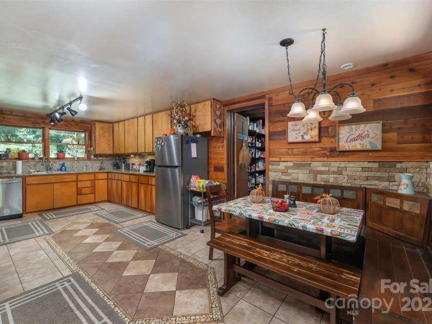 1145 Woolyshot Branch Road, Hot Springs, NC 28743.  MLS# CAR4295648, YatesRealty ID 451. Kitchen and dining area. 