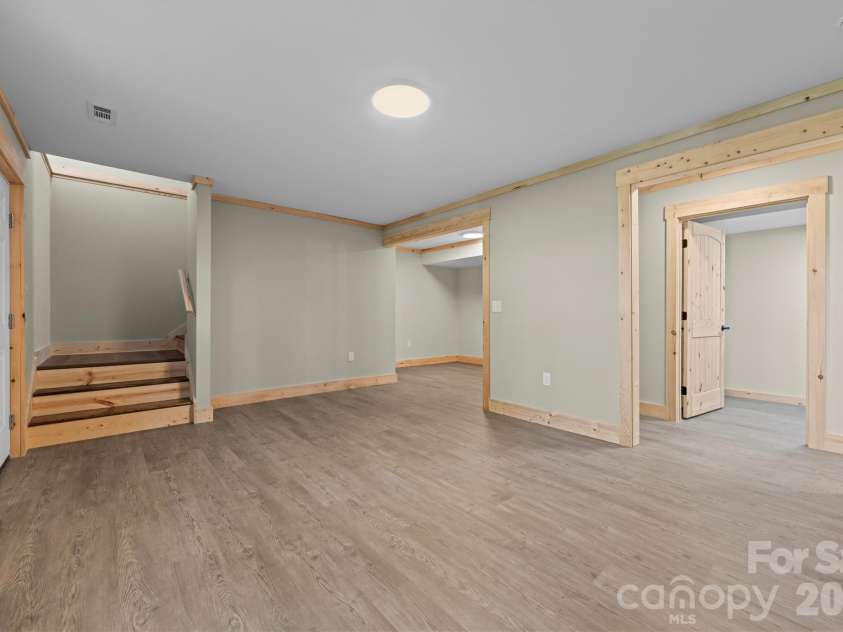 212 Brigsy Lane, Whittier, NC 28789.  MLS# CAR4391142, YatesRealty ID 451. Downstairs Family Room