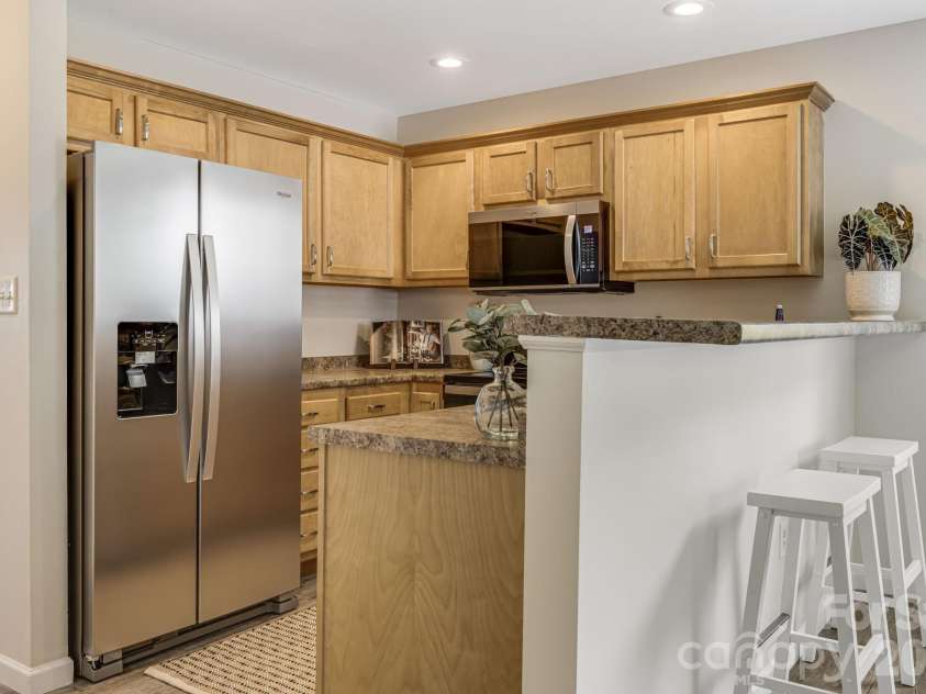 9 Coral Berry Drive, Candler, NC 28715.  MLS# CAR4410894, YatesRealty ID 45105. Kitchen w/breakfast bar