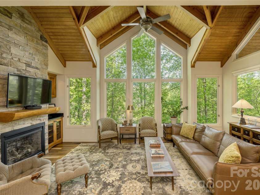 281 Bob White Loop, Waynesville, NC 28786.  MLS# CAR4414207, YatesRealty ID 45126. Soaring Windows in Living Room