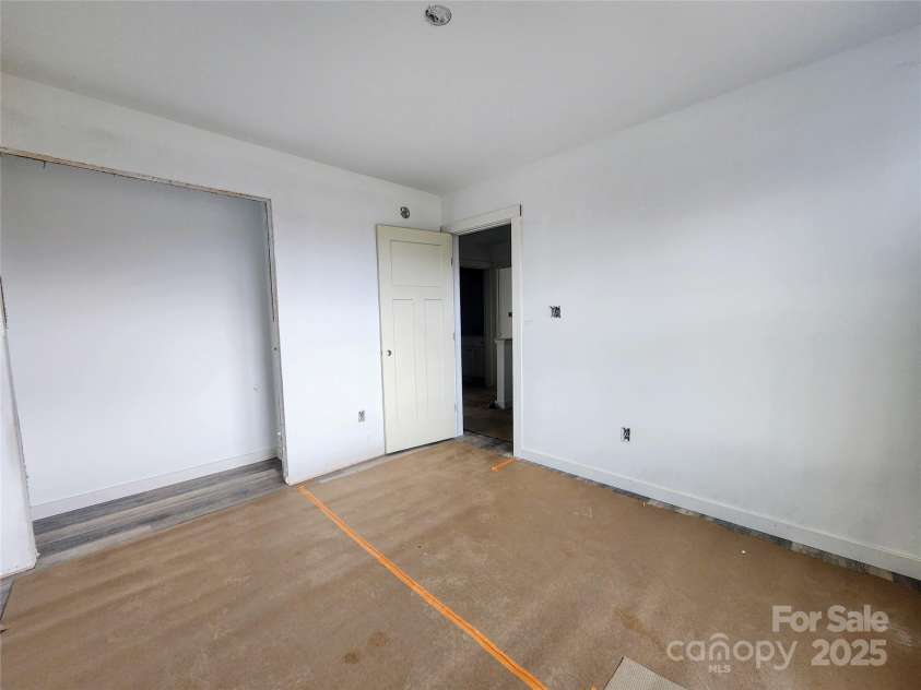 59 Eller Ford Road, Weaverville, NC 28787.  MLS# CAR4229304, YatesRealty ID 4513. Bedroom #2 w/ a large closet.