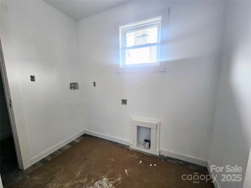 59 Eller Ford Road, Weaverville, NC 28787.  MLS# CAR4229304, YatesRealty ID 4513. Laundry room that is located on the second level for convenience.