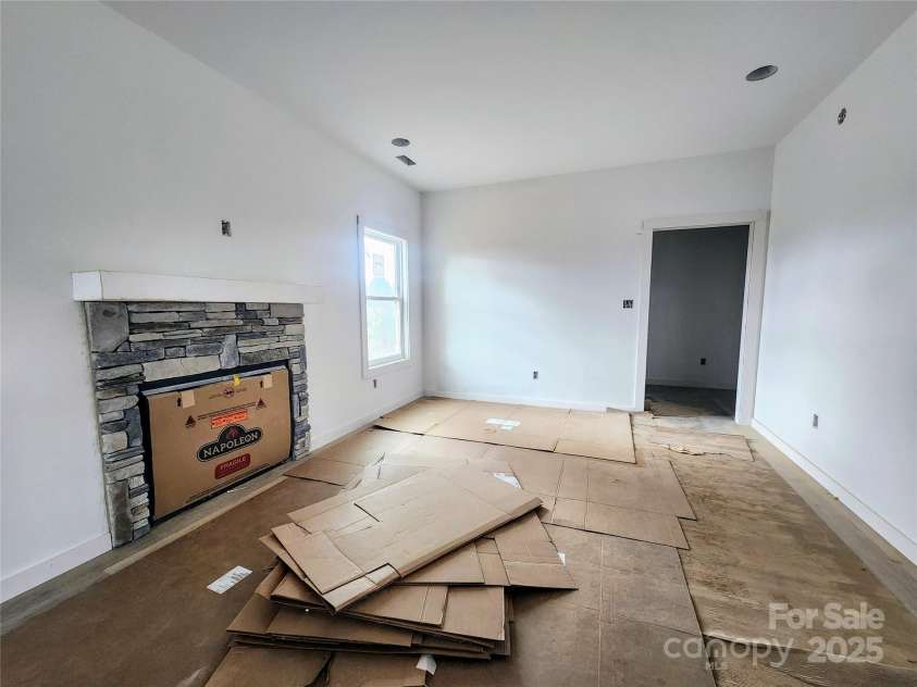 59 Eller Ford Road, Weaverville, NC 28787.  MLS# CAR4229304, YatesRealty ID 4513. Propane Fireplace in Living room.