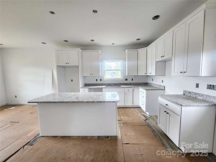 59 Eller Ford Road, Weaverville, NC 28787.  MLS# CAR4229304, YatesRealty ID 4513. White shaker style cabinets w/ soft close drawers, Granite countertops, Stainless  steel steel appliances.