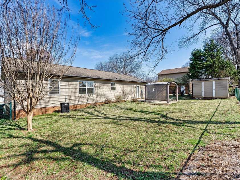 215 Towne Court, Conover, NC 28613.  MLS# CAR4354978, YatesRealty ID 4514. Back Yard/Building View 