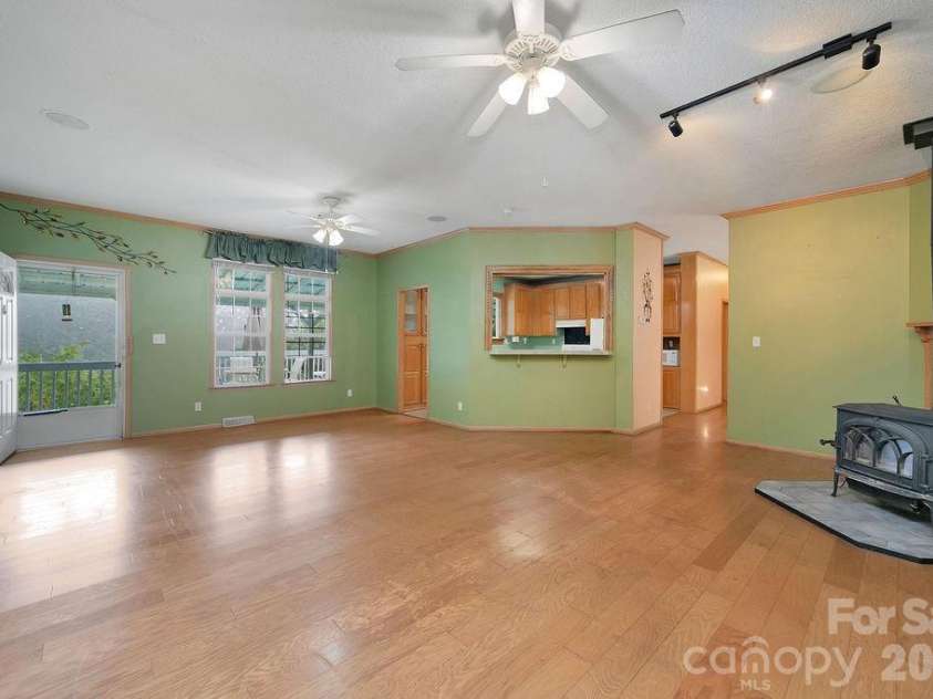 98 New Sorrells Estate, Brevard, NC 28712.  MLS# CAR4414087, YatesRealty ID 45142. Living to Kitchen