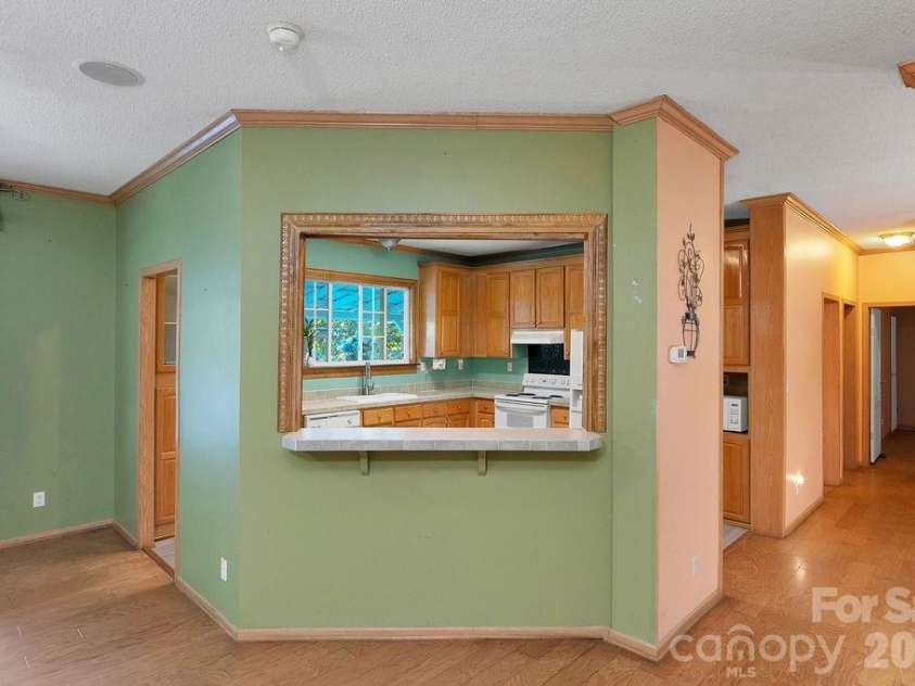 98 New Sorrells Estate, Brevard, NC 28712.  MLS# CAR4414087, YatesRealty ID 45142. Window to Kitchen