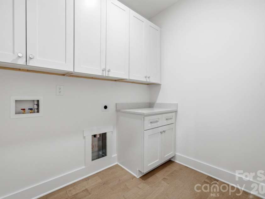 612 Camelot Drive, Salisbury, NC 28144.  MLS# CAR4411574, YatesRealty ID 45149. Upstairs Laundry Room