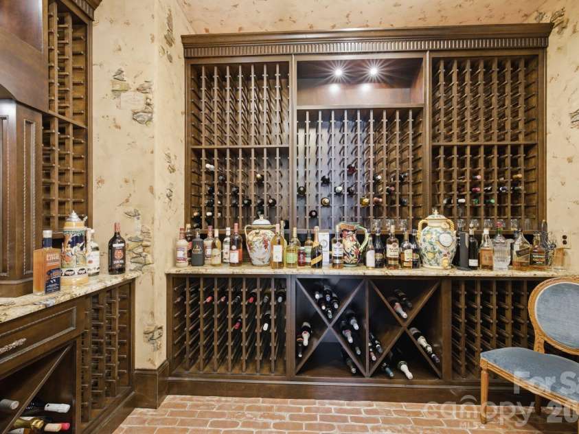 178 Mariner Pointe Lane, Mooresville, NC 28117.  MLS# CAR4414356, YatesRealty ID 45154. Dedicated wine cellar provides custom bottle storage and an intimate space for displaying your collection.
