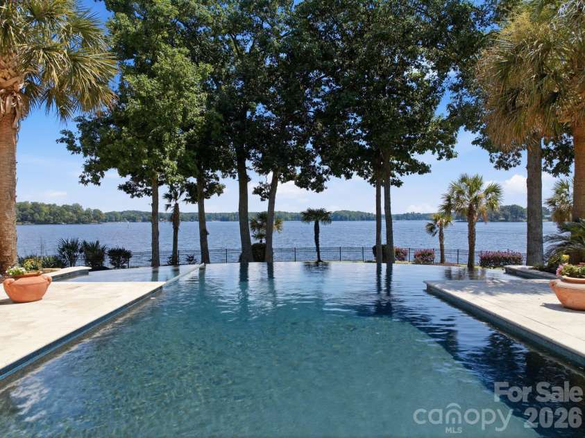 178 Mariner Pointe Lane, Mooresville, NC 28117.  MLS# CAR4414356, YatesRealty ID 45154. Infinity-edge design creates a striking visual connection between the pool and Lake Norman.
