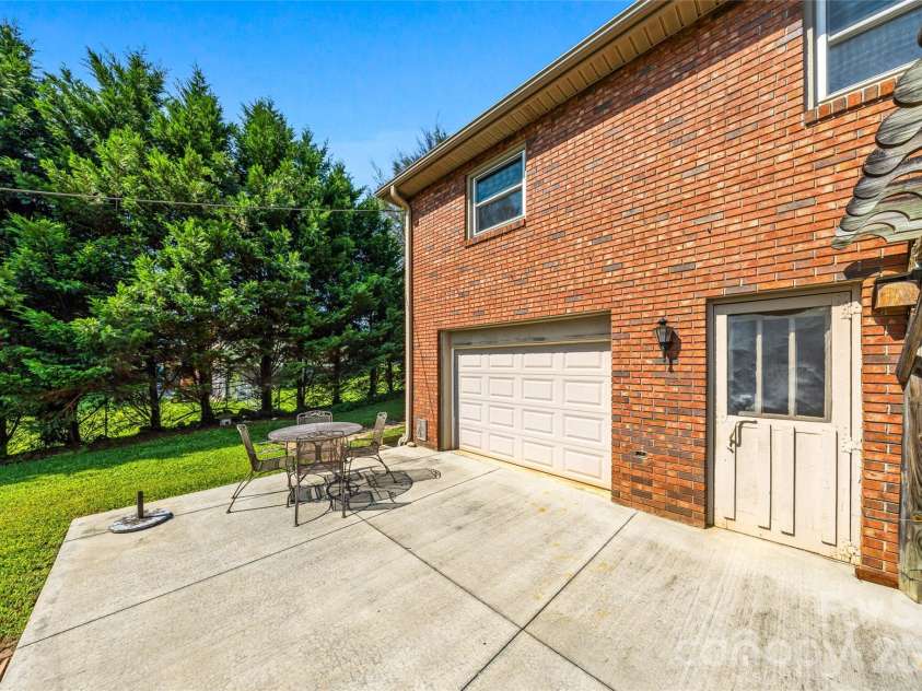 708 Loop Road, Hendersonville, NC 28792.  MLS# CAR4415625, YatesRealty ID 45204. Basement garage door
