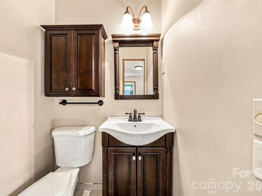 708 Loop Road, Hendersonville, NC 28792.  MLS# CAR4415625, YatesRealty ID 45204. Half bath in primary
