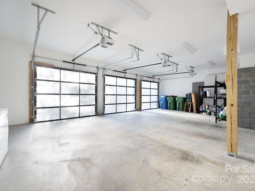 22 Innsbrook Road, Asheville, NC 28804.  MLS# CAR4215149, YatesRealty ID 4523. 3-car garage with flat driveway, room for 6-8 vehicles, and a basketball goal