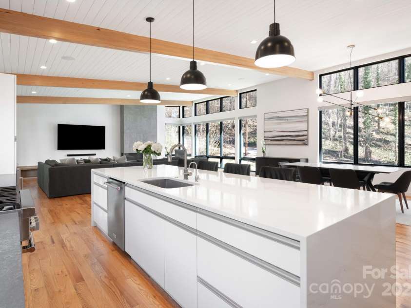 22 Innsbrook Road, Asheville, NC 28804.  MLS# CAR4215149, YatesRealty ID 4523. Nickle-gap shiplap ceiling with exposed beams, contemporary design and luxurious oversized quartz island