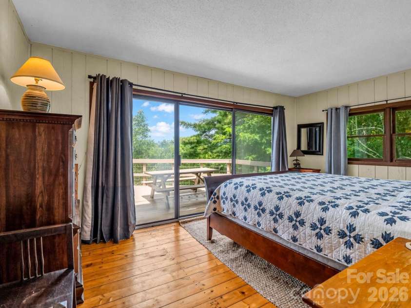 179 Sarvis Lane, Mars Hill, NC 28754.  MLS# CAR4415228, YatesRealty ID 45246. Second ensuite bedroom on main level/top floor