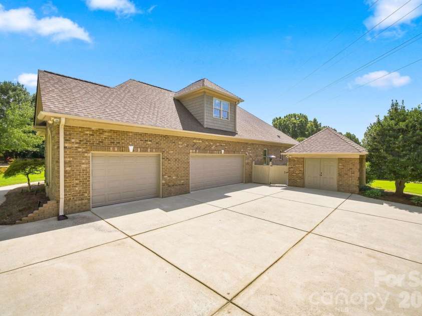 1001 Heritage Acres Drive, Weddington, NC 28104.  MLS# CAR4414833, YatesRealty ID 45250. Oversized 3-car garage with built-in storage.