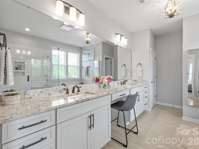 6440 Ancient Way, Fort Mill, SC 29707.  MLS# CAR4413430, YatesRealty ID 45254. Dual vanities, sprawling countertops, and ample cabinetry make this primary ensuite as functional as it is beautiful.