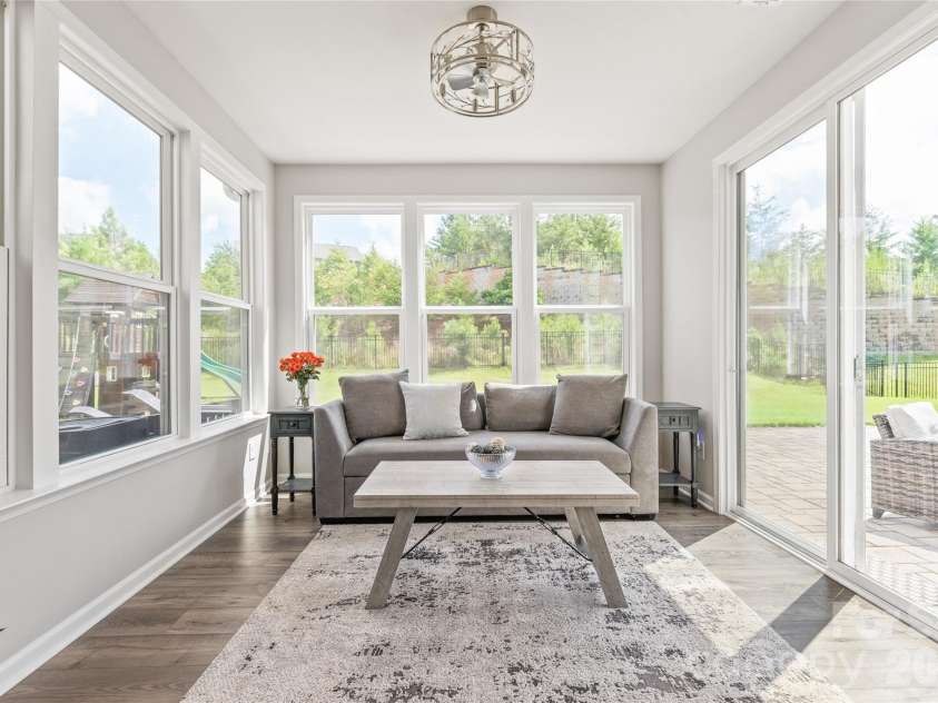 6440 Ancient Way, Fort Mill, SC 29707.  MLS# CAR4413430, YatesRealty ID 45254. Featuring a modern fandelier, this sun-drenched space opens directly out to your private backyard oasis.